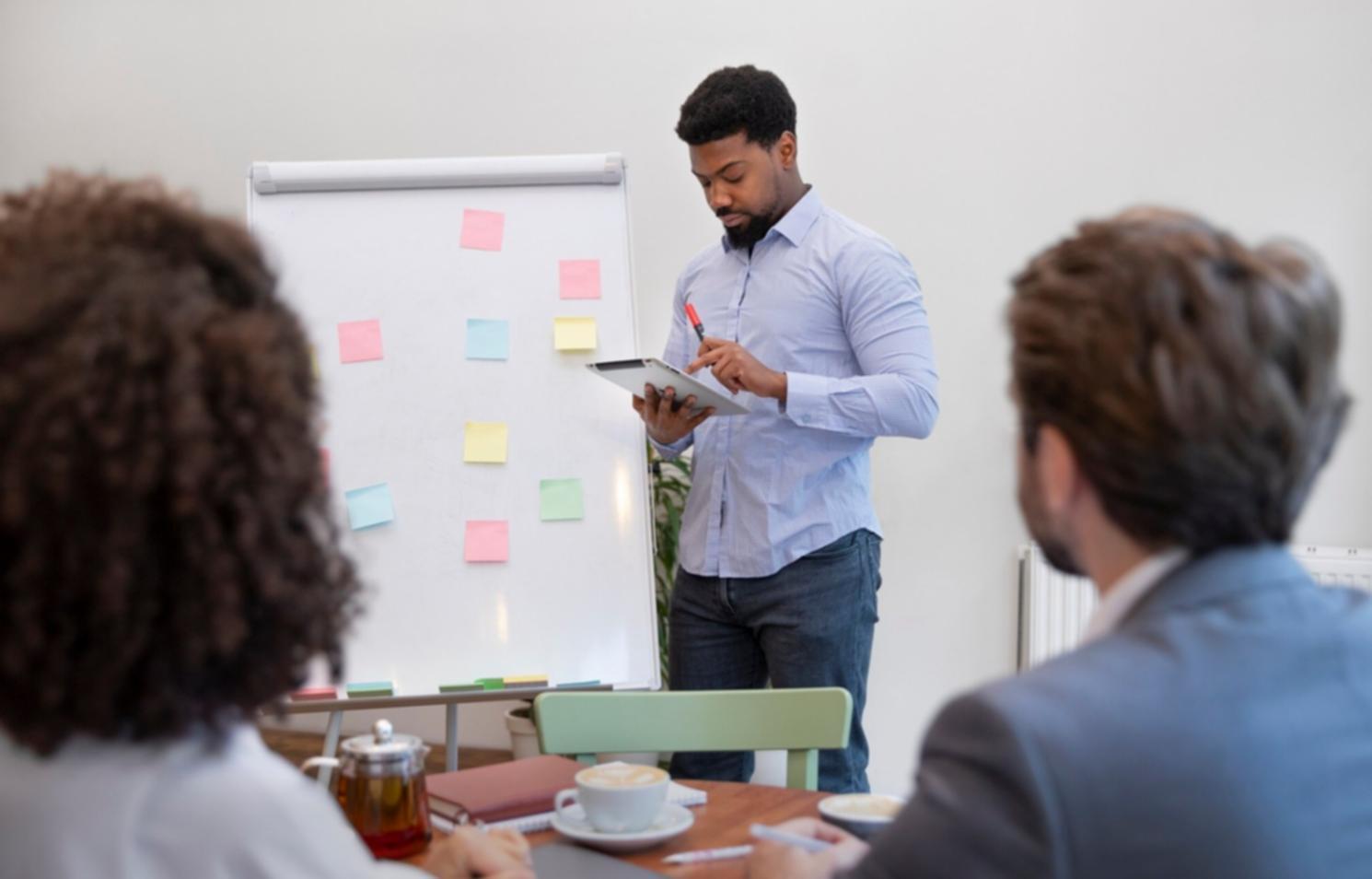 Financial planning workshop session with participants reviewing personal budget strategies